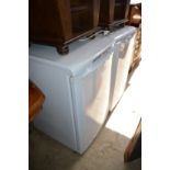 A Hotpoint under counter freezer.