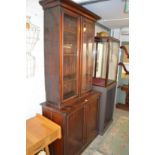A Victorian mahogany cupboard bookcase.