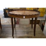 An oval mahogany tray table.