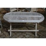 A small hardwood folding oval garden table.