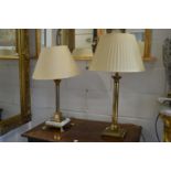 Two Corinthian column style table lamps.