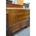 An inlaid mahogany bedroom chest.