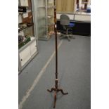 A mahogany pole screen stand.