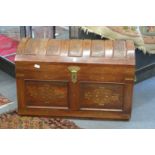 A good eastern carved hardwood and brass inlaid dome topped trunk.