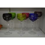 Six coloured hock glasses.