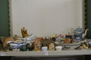 A shelf of decorative china etc.
