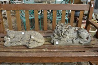 Two garden ornaments modelled as a lion and a sleeping cat.