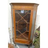 A good inlaid mahogany corner cabinet on stand.