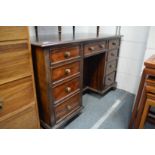 A mahogany kneehole pedestal desk.