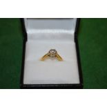 A good golden diamond solitaire ring.