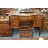 A mahogany serpentine fronted sideboard.