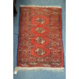 A small Bokhara rug.