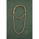 A rope twist and bar necklace stamped 9ct. 22 grams