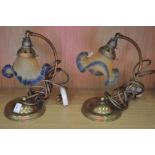 A pair of Art Nouveau style brass table lamps.