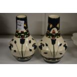 A pair of bottle vases.
