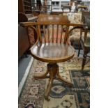 A set of four Thonet bentwood swivel armchairs.