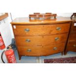 A mahogany three drawer bow front chest.