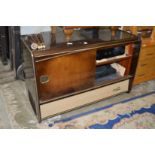 An old radiogram containing a modern amplifier and turntable.