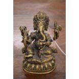 An Indian bronze model of Ganesh.