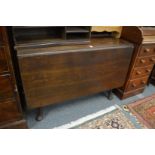 A mahogany drop leaf gateleg dining table.