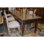 A good 19th century long oak plank top table with two frieze drawers on tapering square legs. 9ft