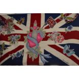 An unusual hand-made tapestry Union Jack wall hanging "Peace, Love, Hope" made by the Rug Company.