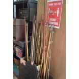 A quantity of snooker cues, rests, extensions etc.