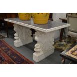 A tile top table with a pair of ornate cast composite and painted supports.