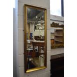 A gilt framed dressing mirror.