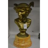 A brass bust of Mercury on a faux marble base.