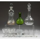 AN EDWARDIAN "HOUR GLASS" DECANTER AND STOPPER together with a modern cut glass decanter, moulded