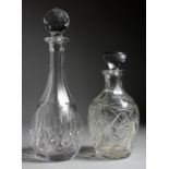 TWO CUT GLASS DECANTERS AND STOPPERS.