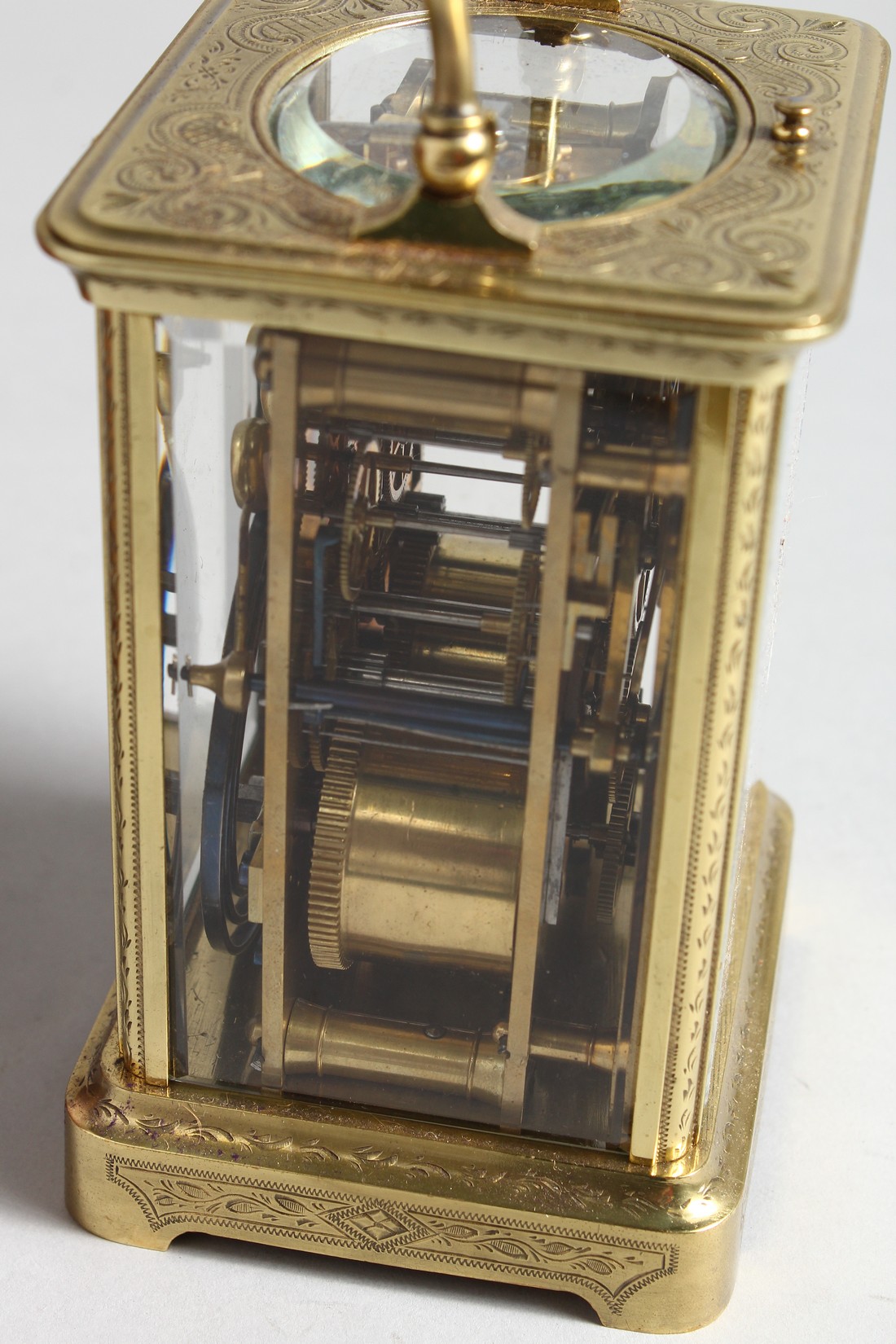 A GOOD FRENCH ENGRAVED BRASS CARRIAGE CLOCK with eight day movement, striking on a gong, enamel dial - Image 5 of 8
