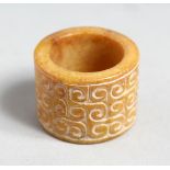 A CHINESE CARVED JADE ARCHERS RING