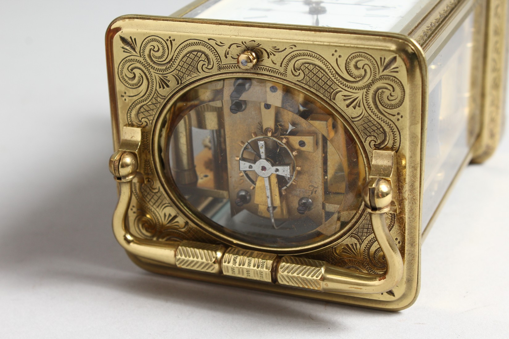 A GOOD FRENCH ENGRAVED BRASS CARRIAGE CLOCK with eight day movement, striking on a gong, enamel dial - Image 6 of 8