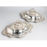 A PAIR OF VICTORIAN PLATED SHAPED ENTRÉE DISHES with rococo decoration.