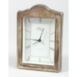 AN R. CARR SILVER CASED CLOCK 7ins high.