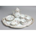 A GOOD HERANED CABERET, comprising of oval tray, two cups and saucers, milk jug, cream bowl and