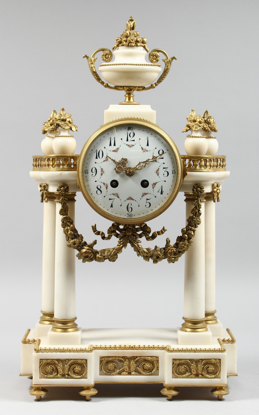A GOOD 19TH CENTURY FRENCH WHITE MARBLE AND ORMOLU PORTICO MANTLE CLOCK with a brass drum shape