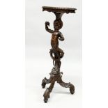 AN 18TH / 19TH CENTURY ITALIAN CARVED WALNUT BLACKAMOOR TORCHERE of typical form, with a shaped top,