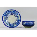 A BOHEMIAN BLUE TINTED BOWL AND STAND with a landscaped decoration.