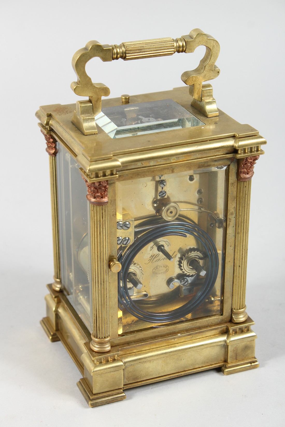 A GOOD GOLDSMITHS & SILVERSMITHS BRASS CARRIAGE CLOCK with repeat action and column supports. 6ins - Image 5 of 9