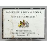 AN ENAMEL ADVERTISING SIGN FOR THOMAS PURDEY & SONS, LONDON. 23.75ins x 16.75ins.