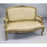 A 19TH CENTURY FRENCH GILTWOOD FRAMED CANAPE, with carved frame and classical cream upholstery.