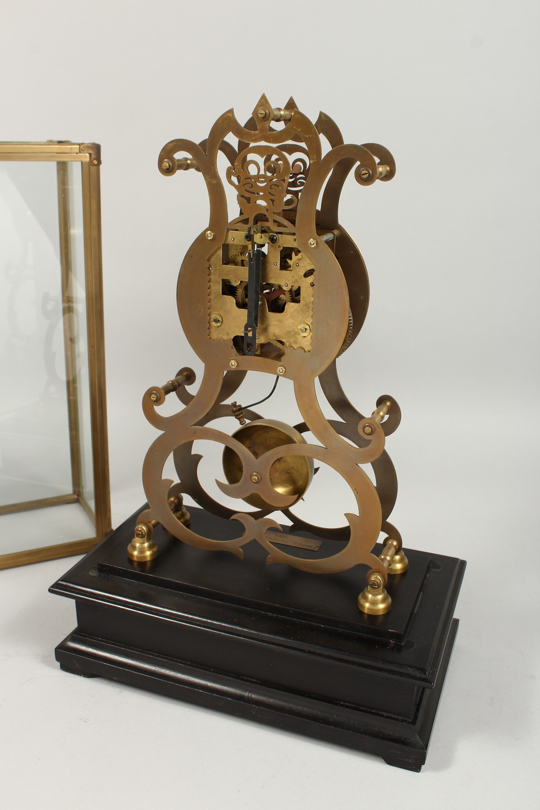 A MOONPHASE BRASS SKELETON CLOCK. 17ins in a glass case. - Image 5 of 5