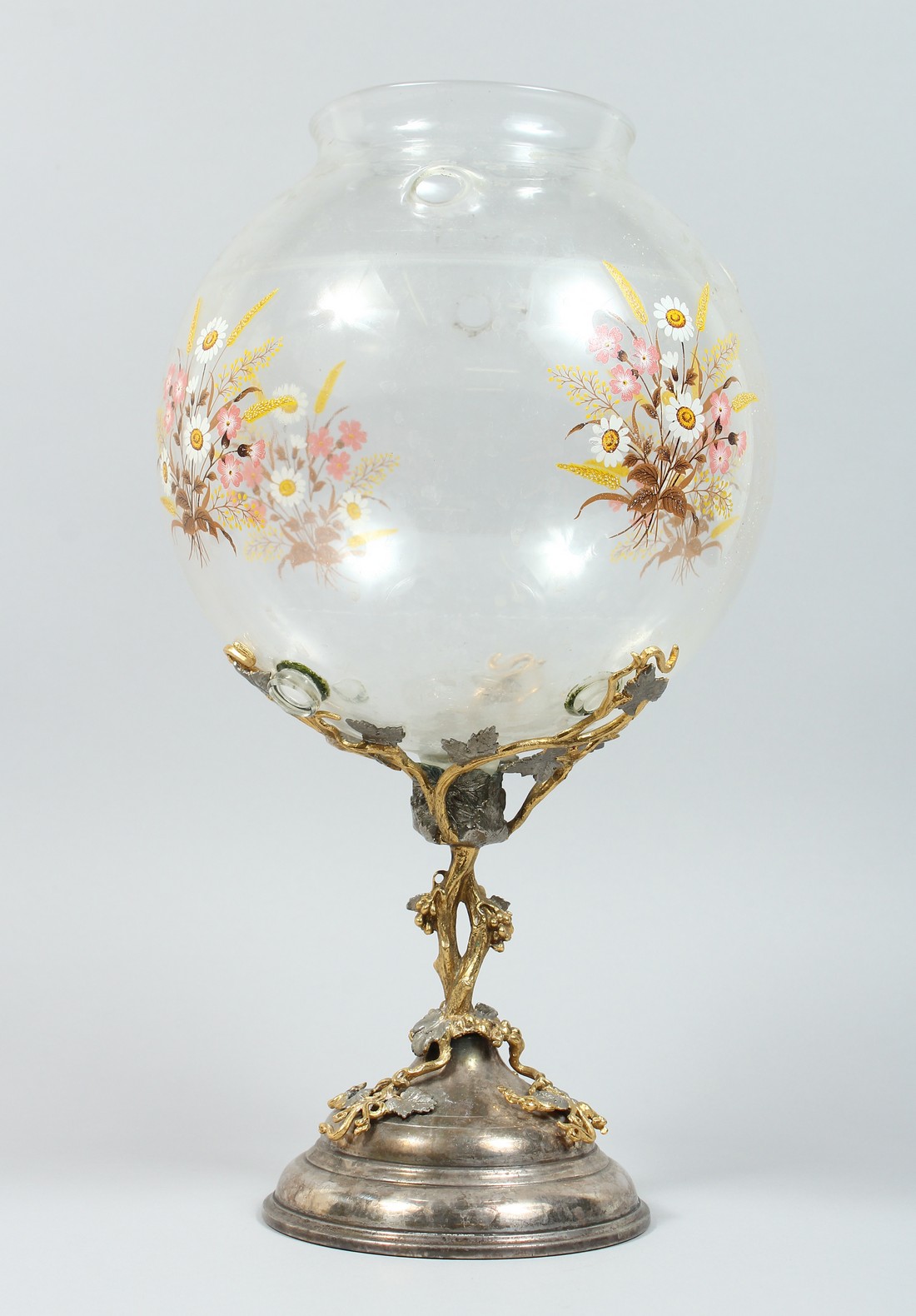 AN UNUSUAL SILVER PLATED ORMOLU AND GLASS PEDESTAL BOWL, the bowl decorated with flowers on a
