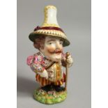A 19TH CENTURY DERBY FIGURE OF A MANSION HOUSE DWARF standing holding a cane, his hat being an