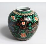 A CHINESE FAMILLE NOIR PORCELAIN JAR. 7ins high.