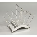 A CHRISTOPHER DRESSER DESIGN SIX DIVISION SILVER PLATED TOAST RACK.