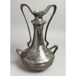 A LARGE W M F. PLATED TWO HANDLED VASE with a young girl's head and scrolling handles. 15ins high.